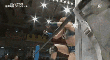 a woman is wrestling in a ring with chinese writing on the bottom