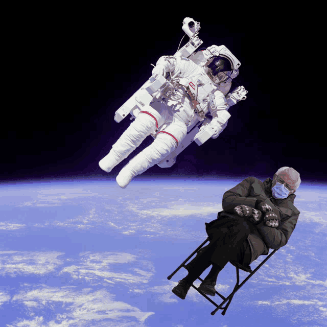 a man wearing mittens is sitting in a chair in front of an astronaut