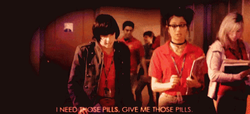 a group of people standing in a hallway with the words " i need those pills give me those pills "