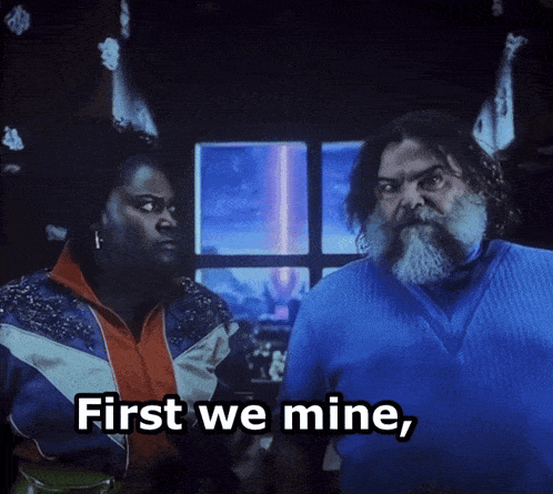 a man and a woman are standing next to each other with the words first we mine
