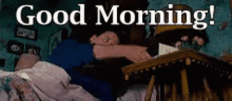 a couple laying in bed with the words `` good morning '' written on the bottom