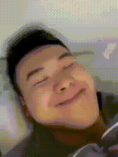 a man is laying in bed with his eyes closed and making a funny face