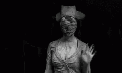 a black and white photo of a woman dressed as a nurse waving her hand .