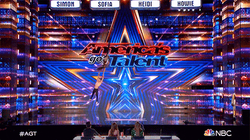 an ad for america 's got talent shows a man holding a woman in the air