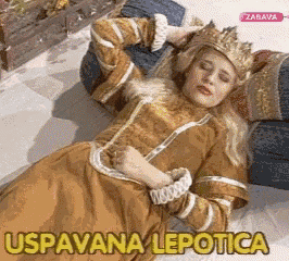 a woman wearing a crown is laying on a couch with the words uspavana lepotica written on the bottom