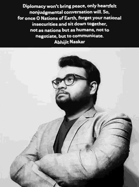 a black and white photo of a man with a quote about diplomacy