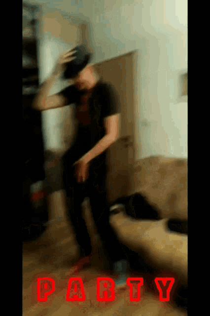 a blurry picture of a man dancing with the word party written in red