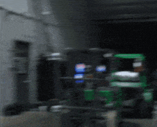 a blurred image of a pepsi machine in a warehouse