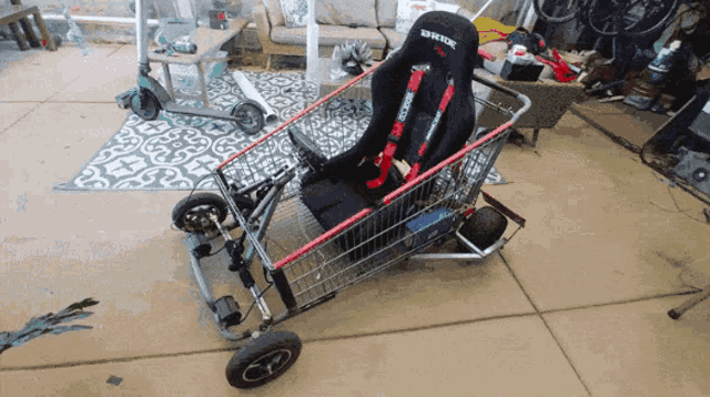 a shopping cart with a seat that says greddy