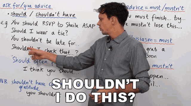 a man stands in front of a white board with the words shouldn 't i do this