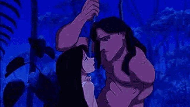 a man and a woman are standing next to each other in the jungle and looking at each other .