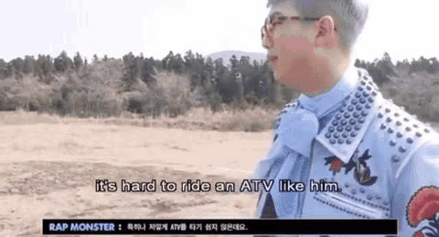 a man says it 's hard to ride an atv like him while standing in a field