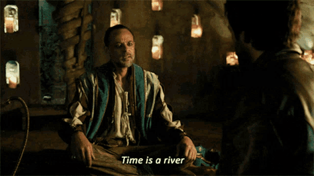 a man says time is a river while sitting in a room