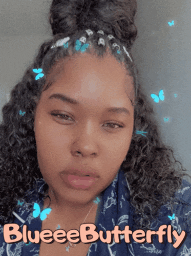a woman with blue butterflies in her hair and the words blueeebutterfly on the bottom