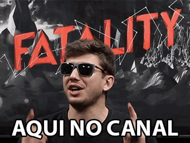 a man wearing sunglasses is standing in front of a poster that says fatality aqui no canal