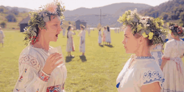 two women with flowers in their hair are talking to each other with the words buy bt written on the bottom