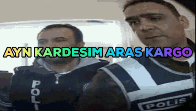 two police officers are standing next to each other with the words ayn kardesimaras kargo written on the bottom