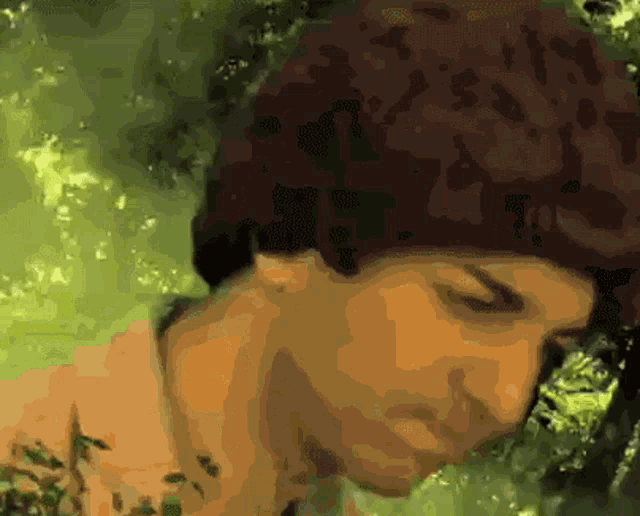 a close up of a person 's face with a blurred background