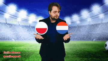 a man in a suit stands in front of a soccer field holding two flags in his hands