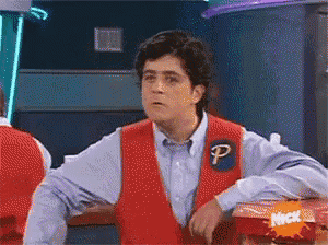 a man wearing a red vest with the letter p on the front