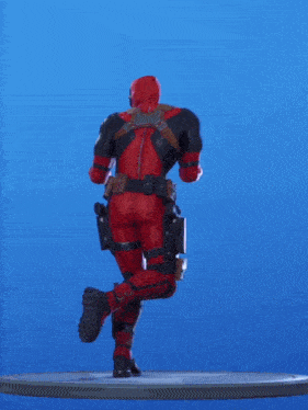 a deadpool figure is standing on a platform with his arms outstretched