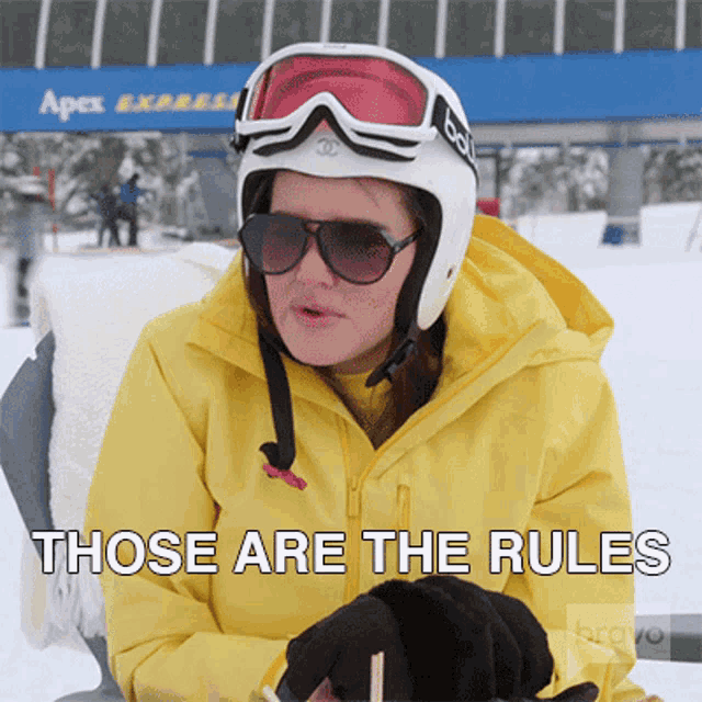 a woman wearing a ski helmet and sunglasses says " those are the rules "
