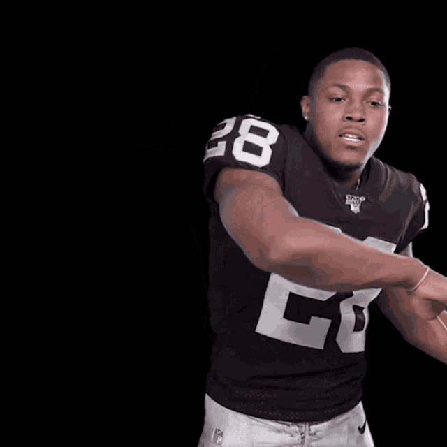 a football player wearing a number 28 jersey