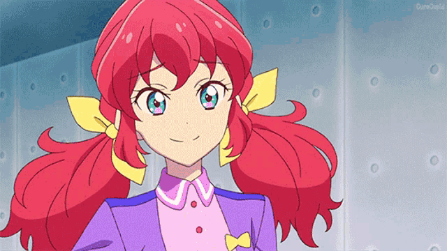 a girl with red hair is wearing a purple shirt