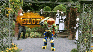 a man in a costume stands in front of a slot sign