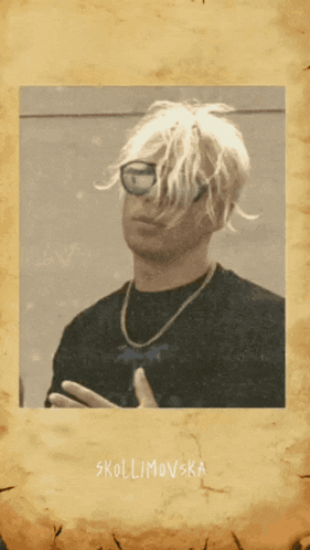 a wanted poster has a picture of a man with white hair and glasses