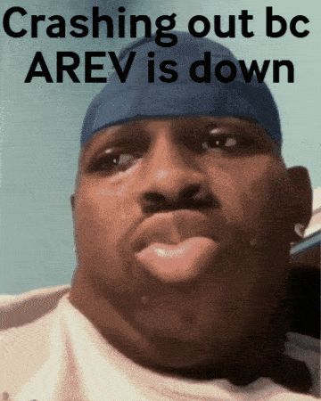 a man with a blue headband is crying with the words crashing out bc arev is down above him