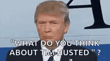 donald trump is wearing a suit and tie and says `` what do you think about tim hugged '' .