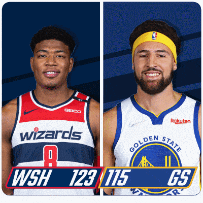 a wizards player and a golden state warriors player pose for a photo