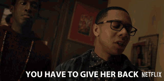 a man wearing glasses says " you have to give her back "