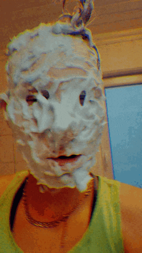 a person with shaving foam on their face