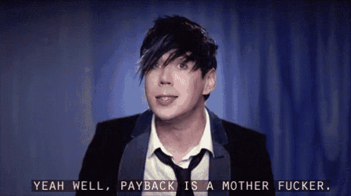 a man in a suit and tie is saying " yeah well payback is a mother fucker "