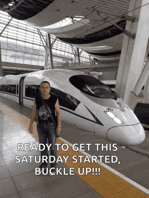 a man is standing in front of a bullet train with the caption " ready to get this saturday started buckle up !!! "