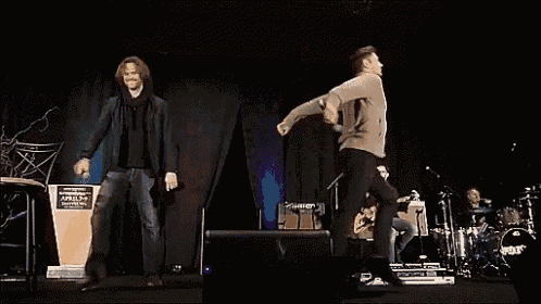 a man stands on a stage in front of a podium that says ' apocalypse ' on it