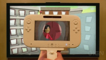a person is holding a nintendo wii controller in front of a tv