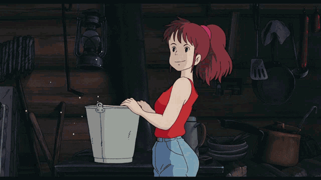 a girl in a red tank top is standing in a kitchen