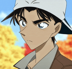 a young man wearing a baseball cap and a jacket