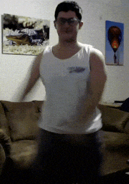 a man wearing glasses and a white tank top that says california