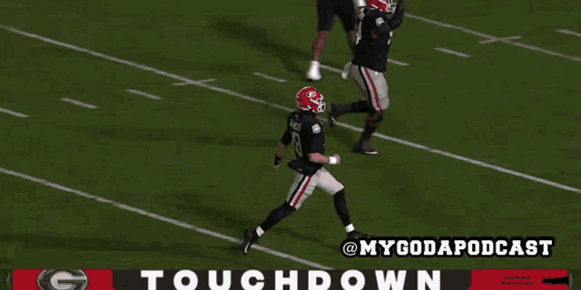 a football game is being shown on a screen with the words touchdown at the bottom