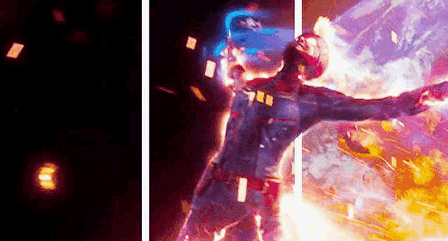 a man in a superhero costume with his arms outstretched is standing in front of a fireball .