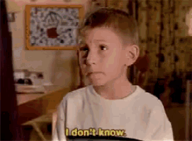 a young boy in a white shirt says i don 't know