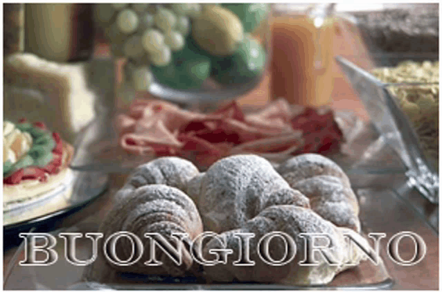 a bunch of powdered sugar croissants are on a plate with the words buongiorno written on the bottom