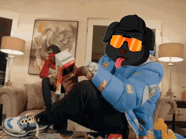 a dog wearing sunglasses and a blue jacket is sitting on a couch eating a candy bar