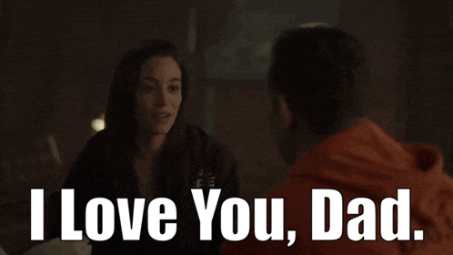 a man and a woman are sitting next to each other and the man is saying i love you dad