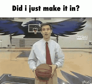 a man in a suit and tie is holding a basketball on a basketball court and says did i just make it in ?