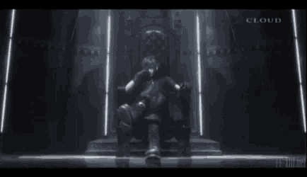 a man is sitting on a throne in a dark room with lights .